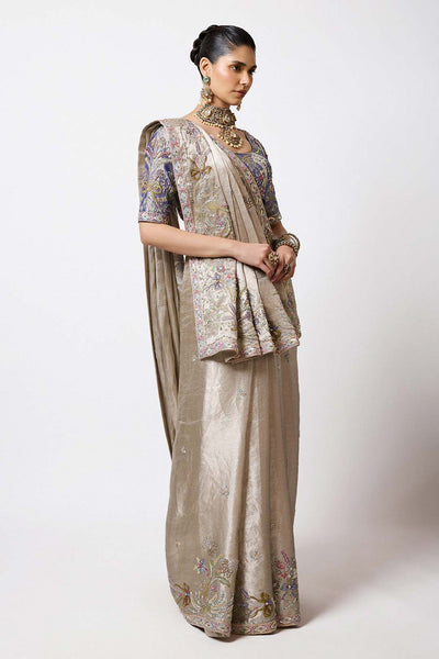 Woman in metallic applique Banarasi set right profile