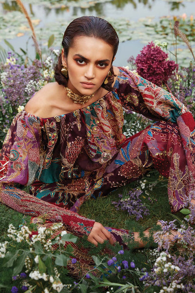 Aisha Rao plum jumpsuit close-up showing organza print