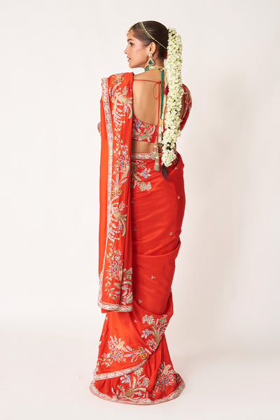Back view of red embellished dupion silk saree