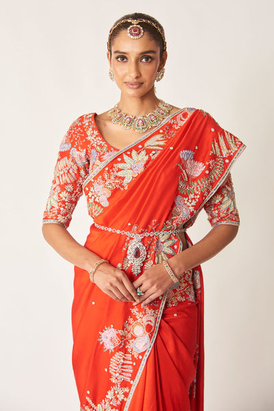 Close-up of red embroidery on dupion silk saree