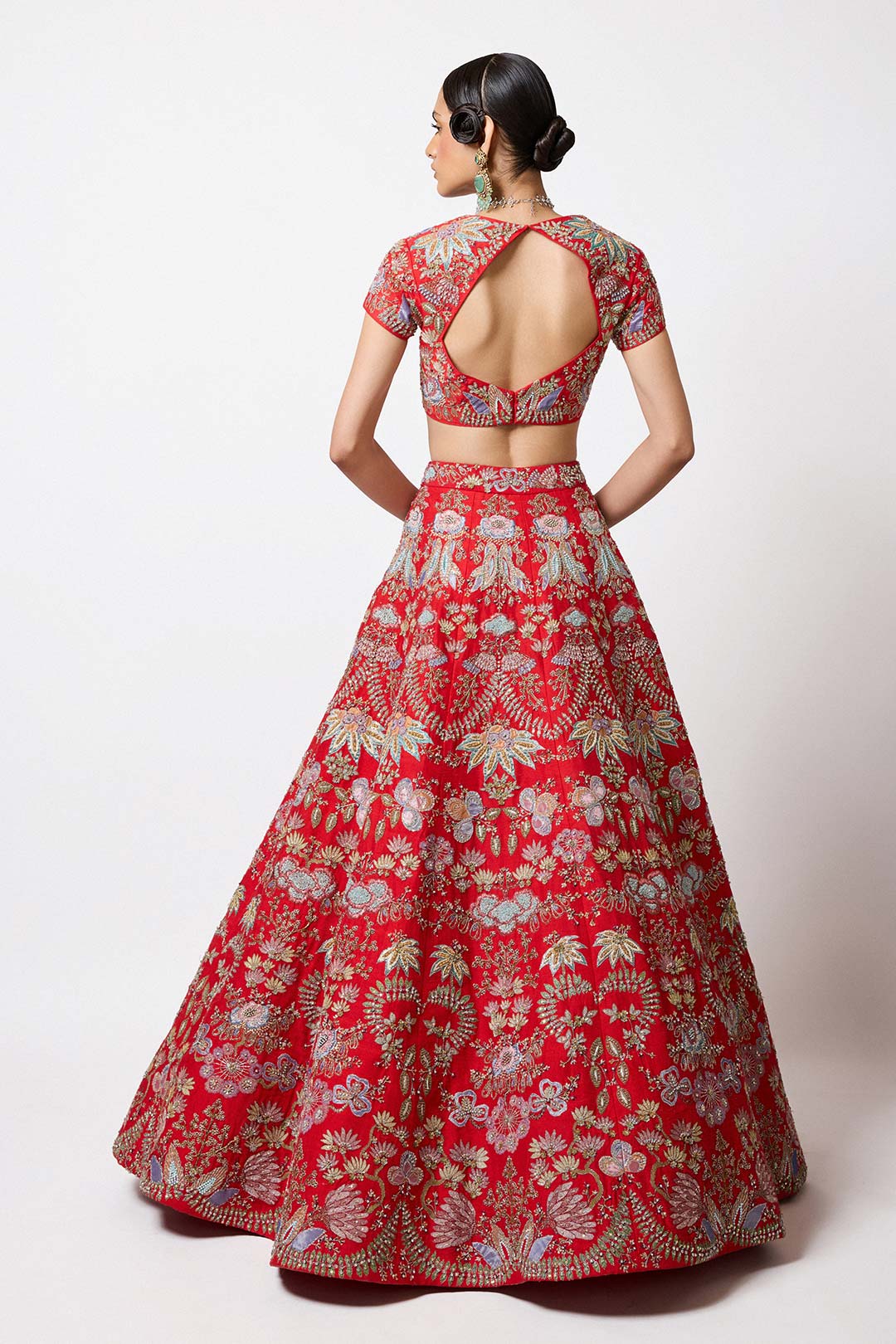 Rear view of Aisha Rao red lehenga and blouse in raw silk