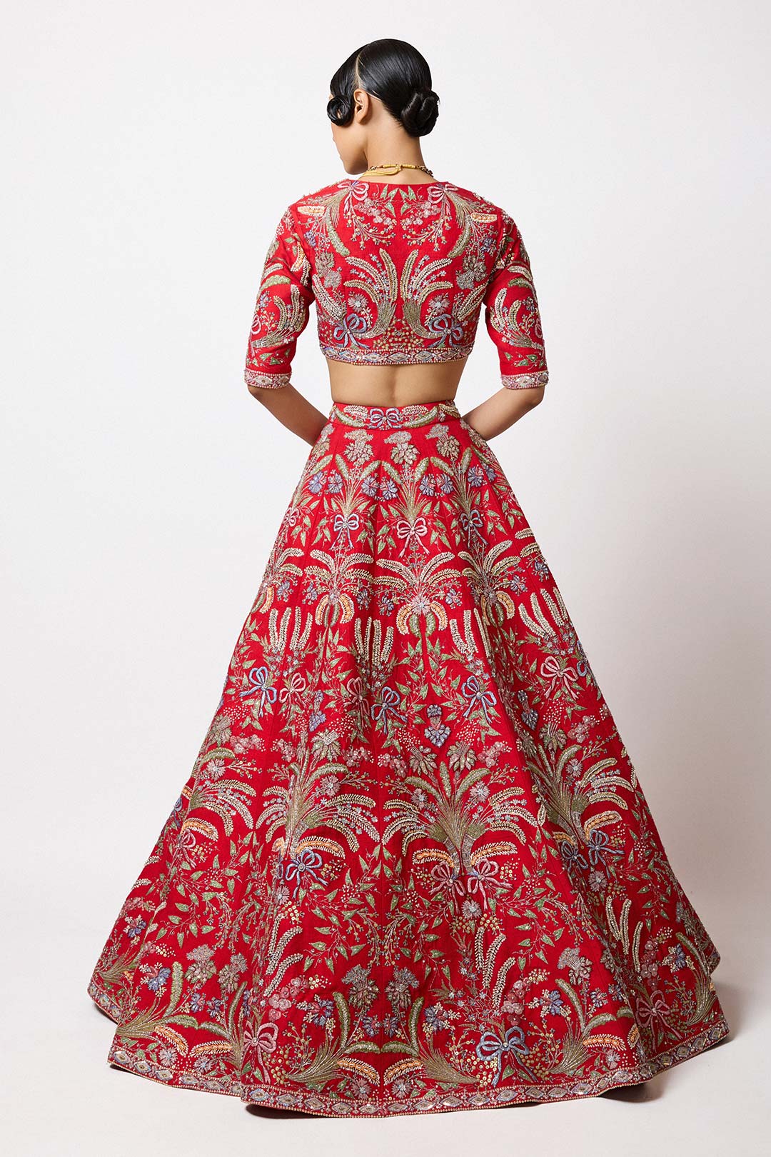Red applique lehenga with tied bow and flare back vie
