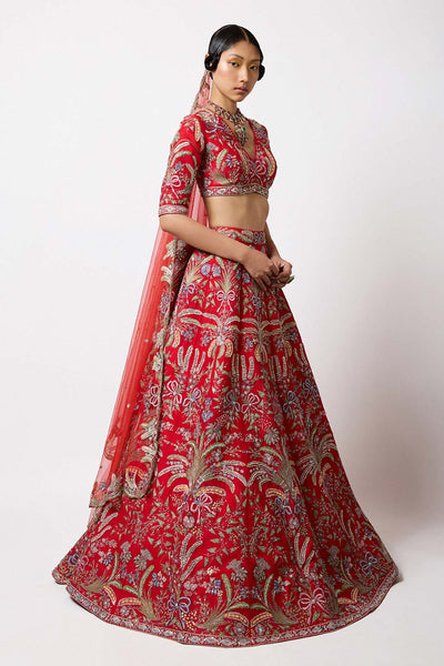 Right side view of Aisha Rao red HK lehenga with blouse