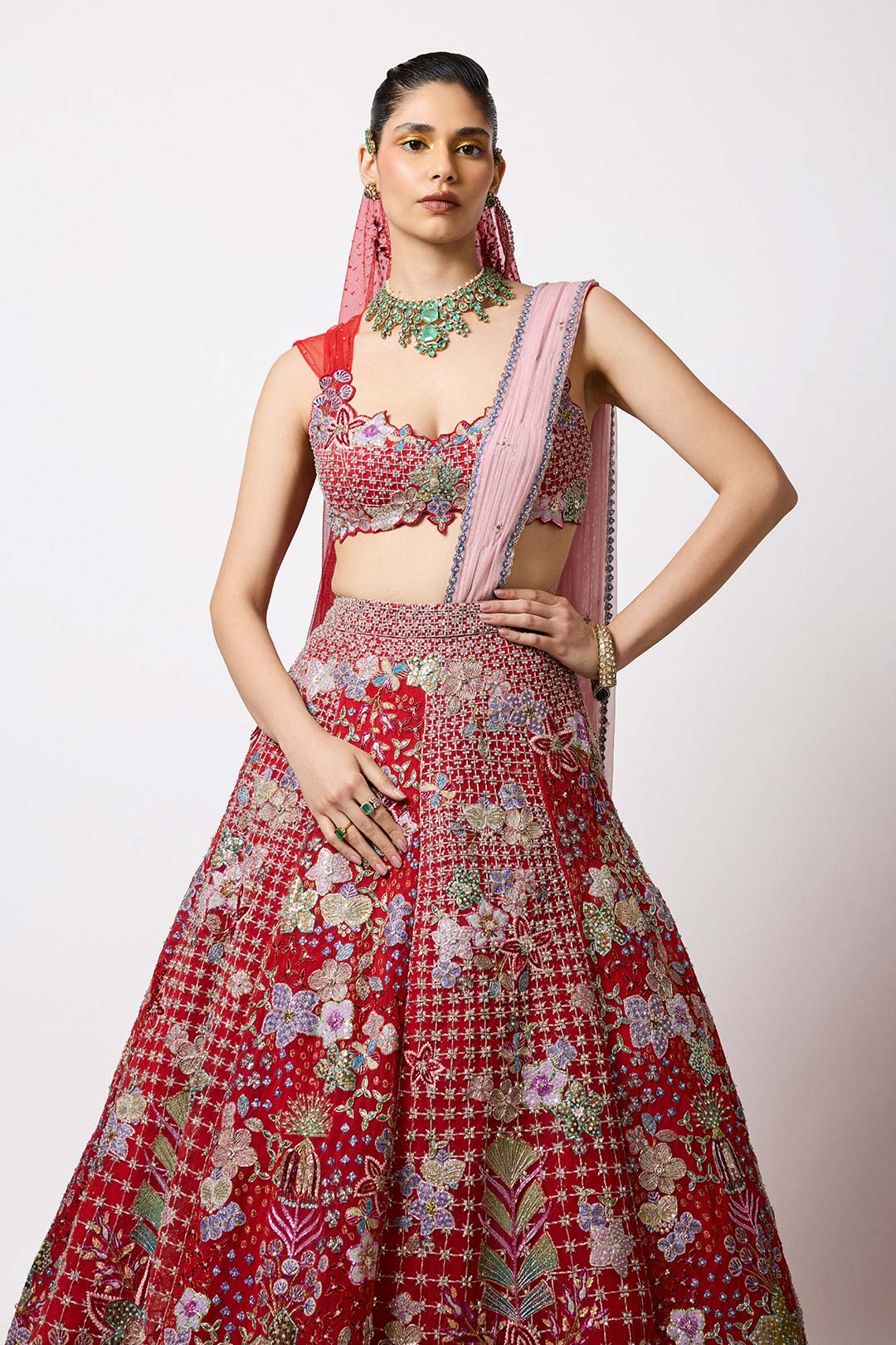 Red tulle lehenga blouse with embellished detail close-up