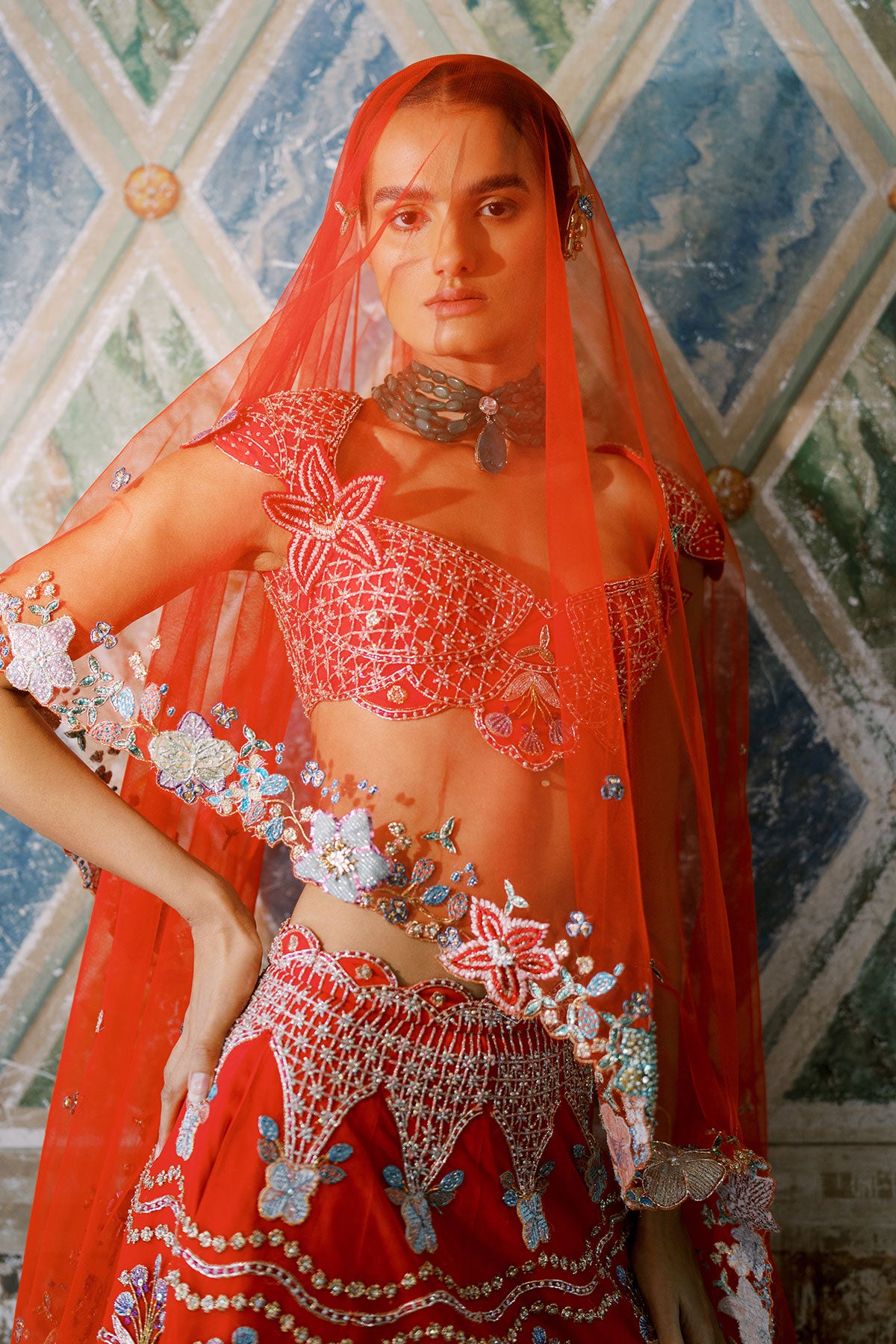 Woman in Aisha Rao applique lehenga, left side angle