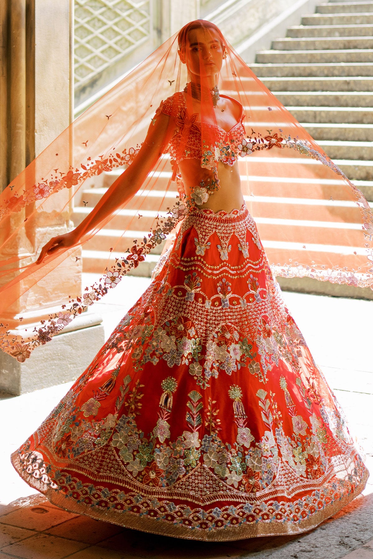 Rear view of Aisha Rao bridal red raw silk lehenga