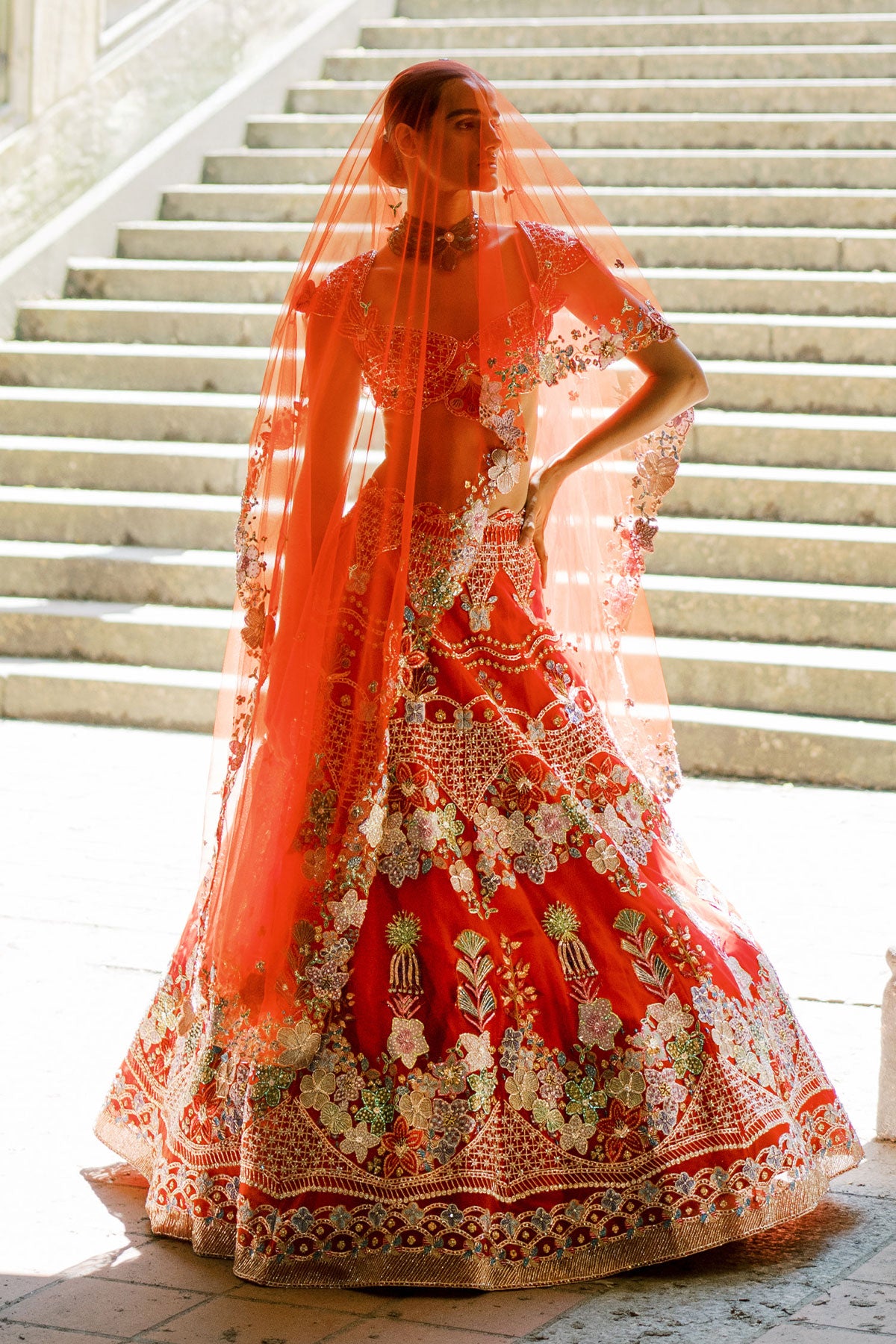Bridal red lehenga with dupatta, right-facing view