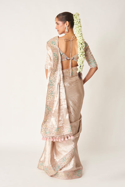 Back view of brocade blouse and draped saree