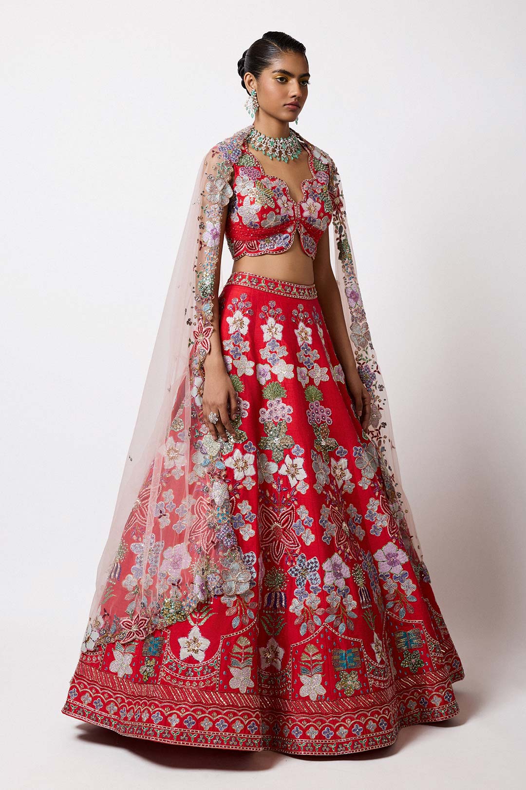 Woman wearing Aisha Rao red raw silk applique lehenga