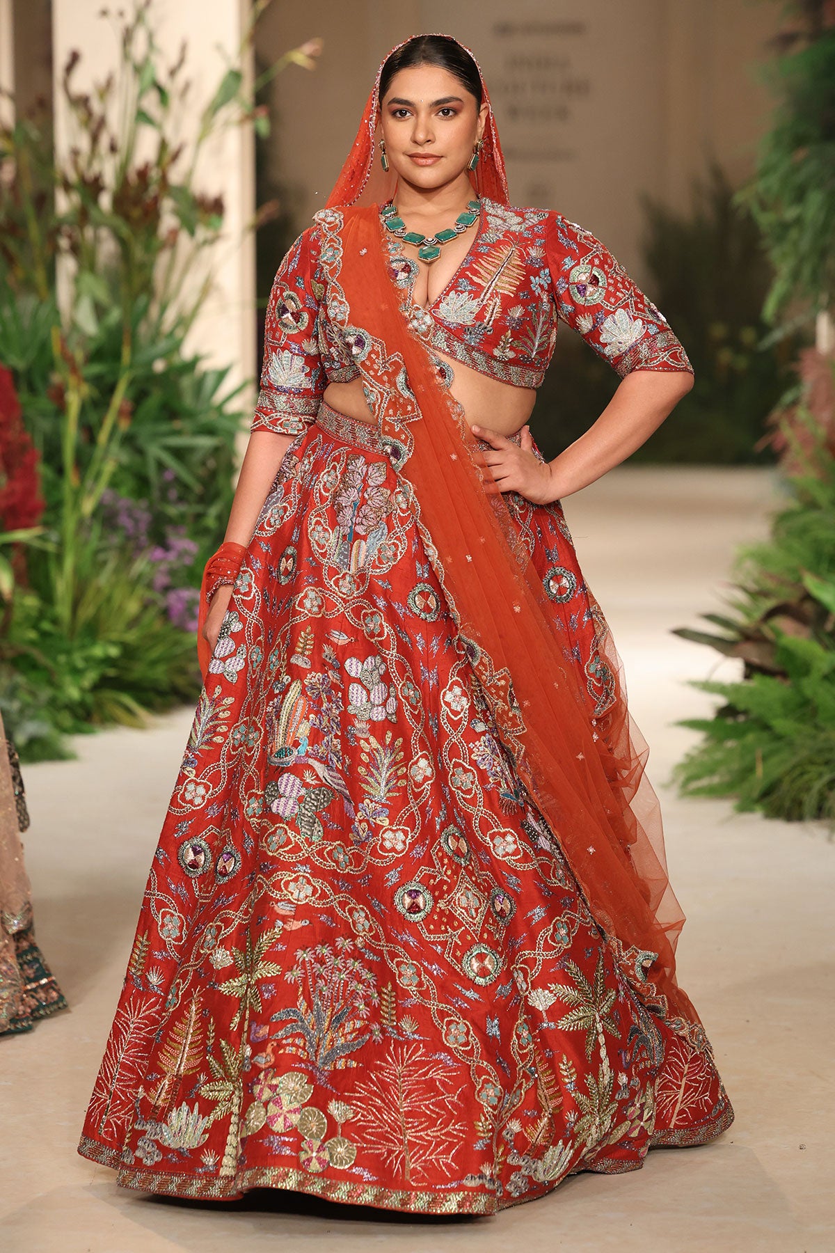 Closeup of the tulle dupatta border styled with the rust raw silk lehenga.