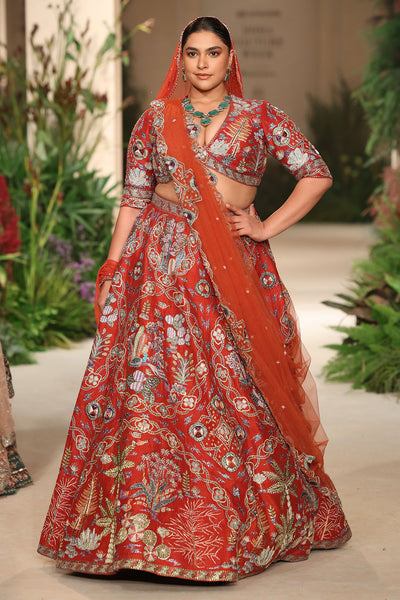 Closeup of the tulle dupatta border styled with the rust raw silk lehenga.