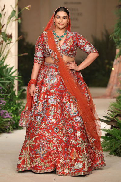 Tulle dupatta drape shot paired with the Wild At Heart rust raw silk lehenga.