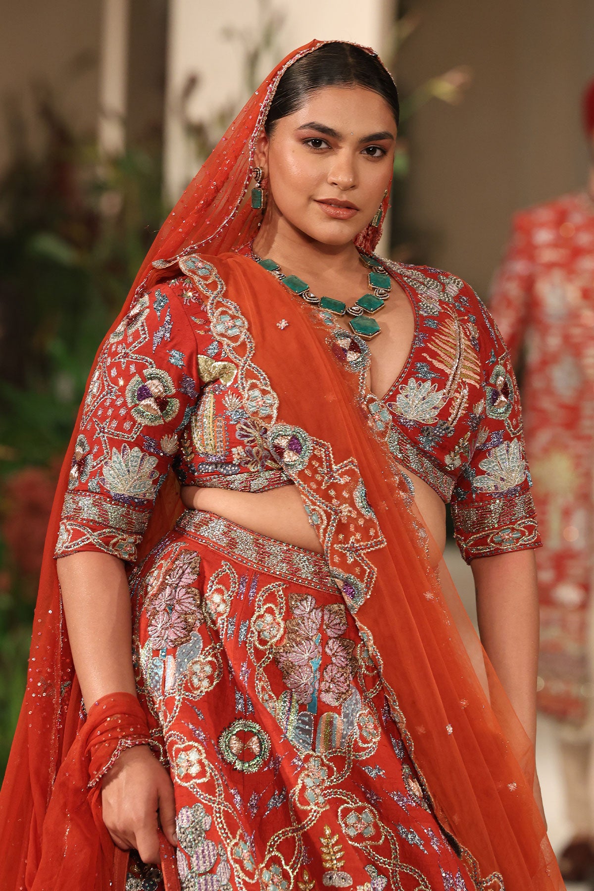 Closeup of the hemline showcasing fine finishing and applique texture.