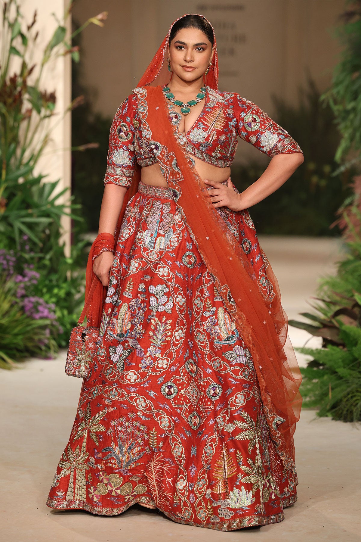Styled look of the Wild At Heart rust raw silk lehenga with blouse, dupatta, and veil.