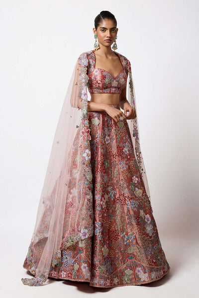 Woman wearing Aisha Rao rust red tissue applique lehenga