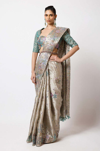 Woman in silver applique Banarasi set right profile view