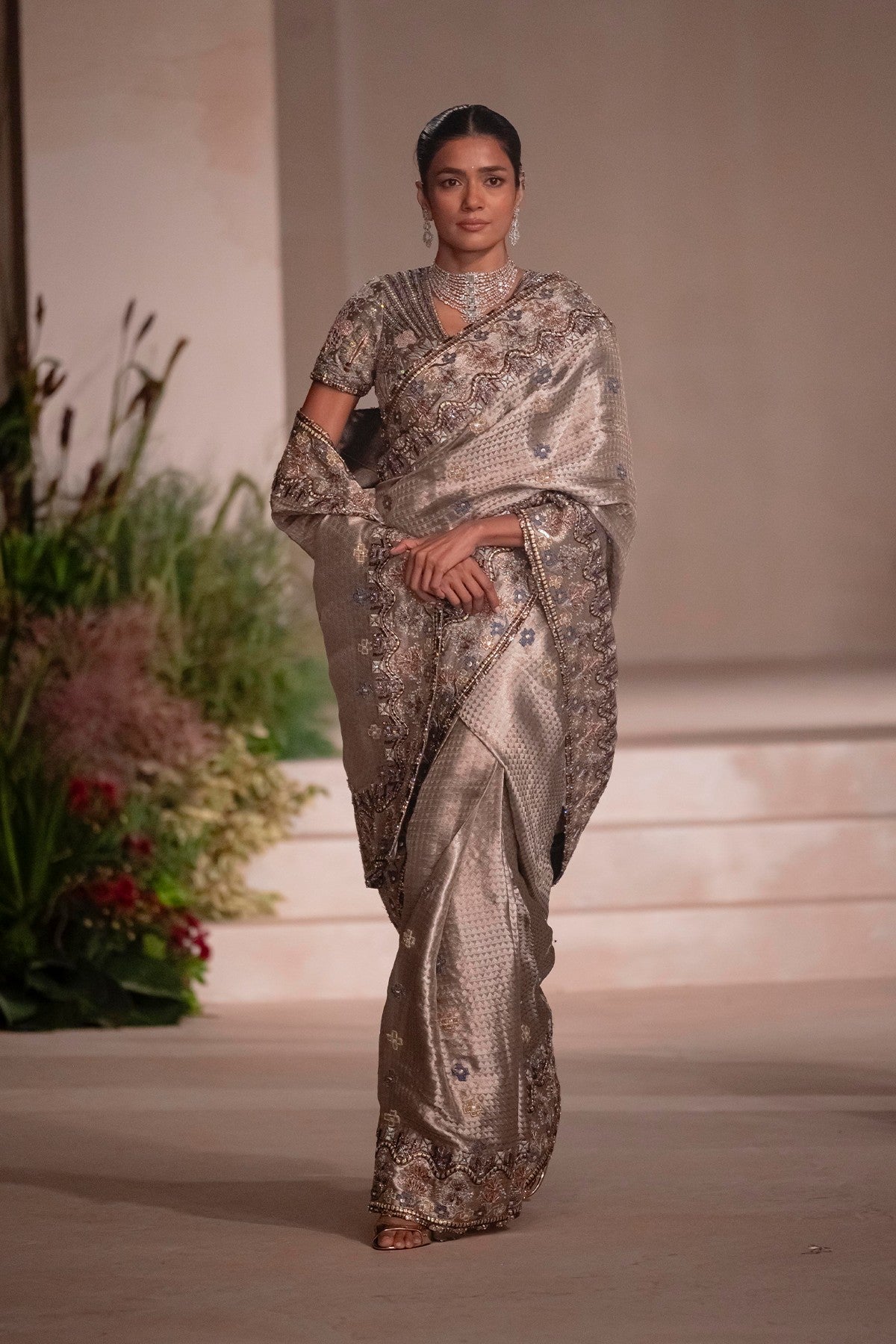 “Hand-applique detailing captured on the silver Banarasi tissue brocade saree.”