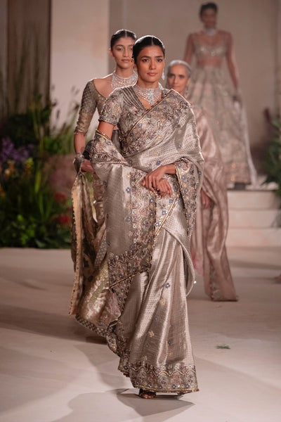 “Pleats detail of the silver Banarasi tissue brocade saree showcasing rich brocade texture.”