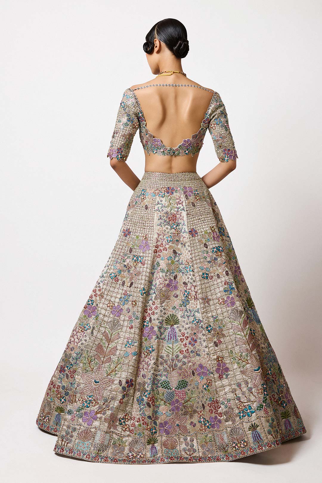 Embroidery and neckline detail close-up silver gold fabric