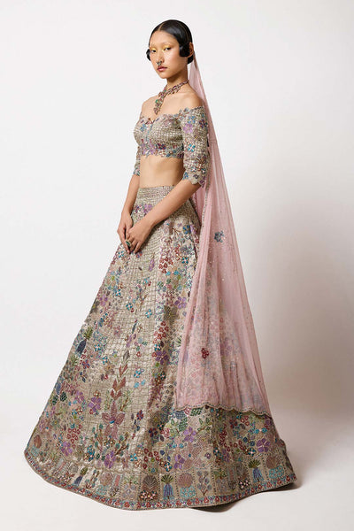 Close up of the Silver Gold Banarasi Tissue Brocade Lehenga revealing the detailed banarasi weave and gold tissue finish.