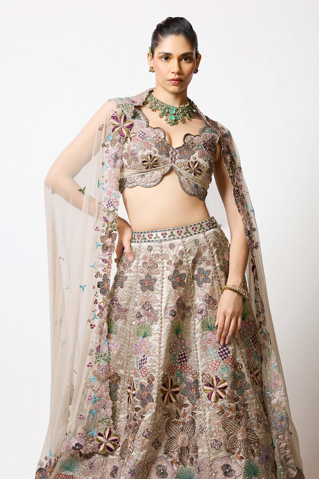 Woman in Aisha Rao silver gold tissue set right view