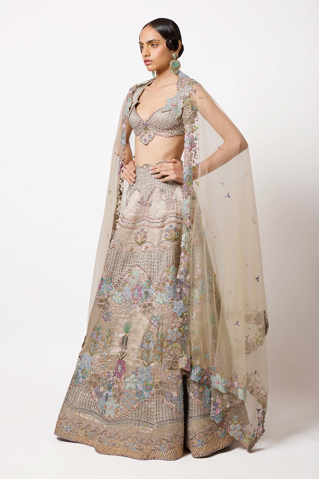 Woman in silver grey tissue set left side profile