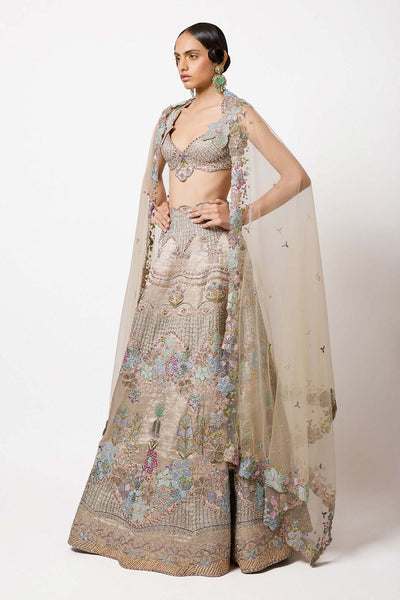 Woman in silver grey tissue set left side profile