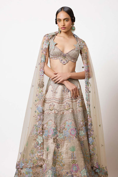 Woman wearing silver grey Aisha Rao outfit right profile