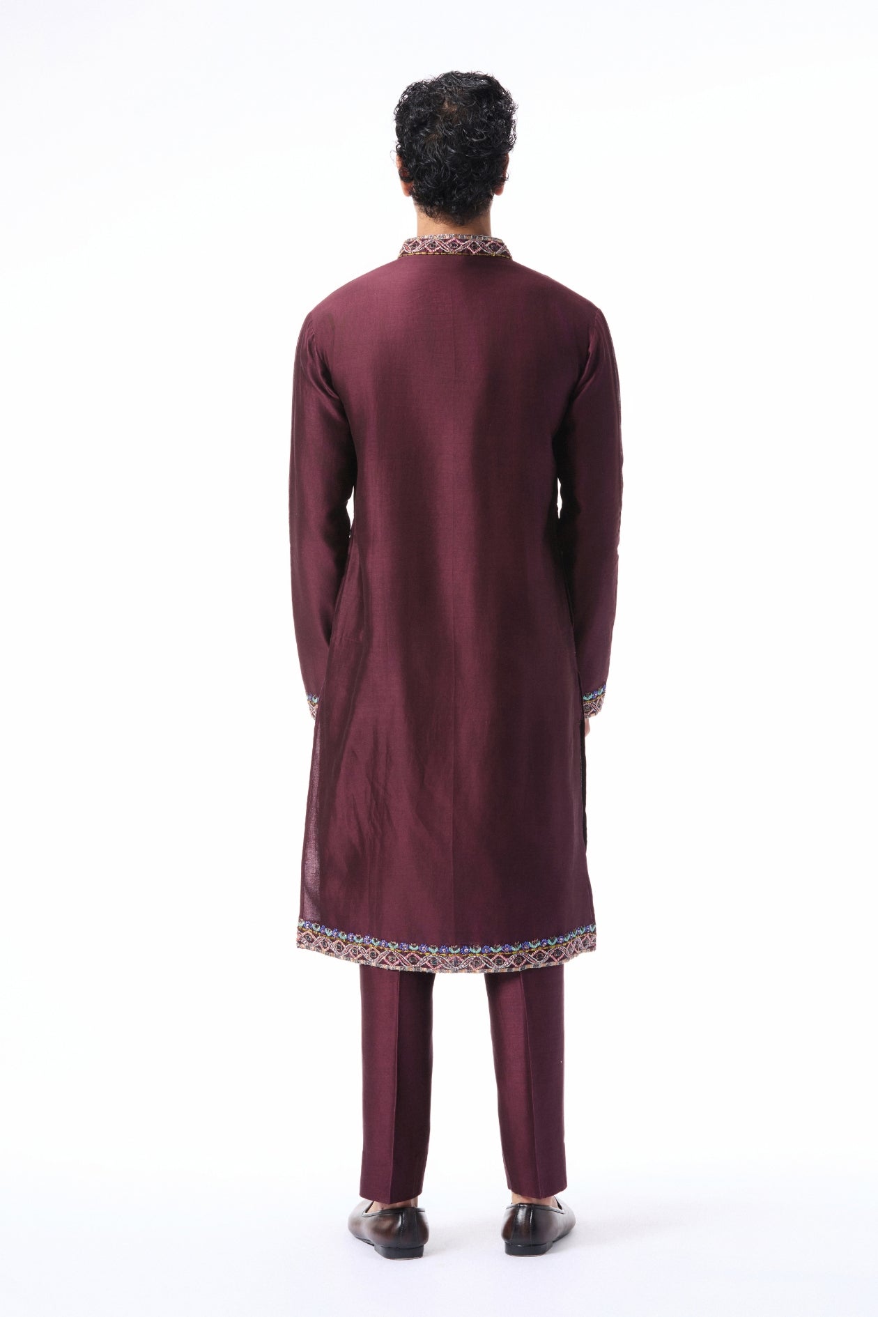Back profile of the teakberry applique embellished chanderi silk kurta paired with pants.