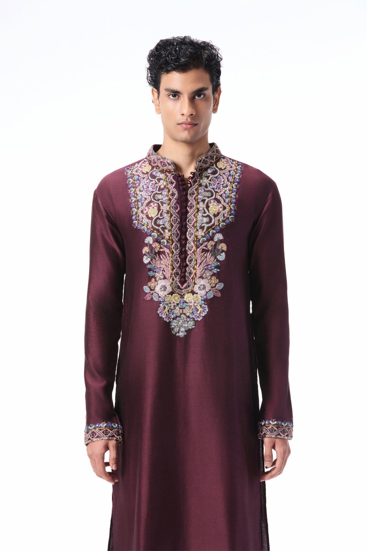 Man wearing a maroon embroidered kurta 