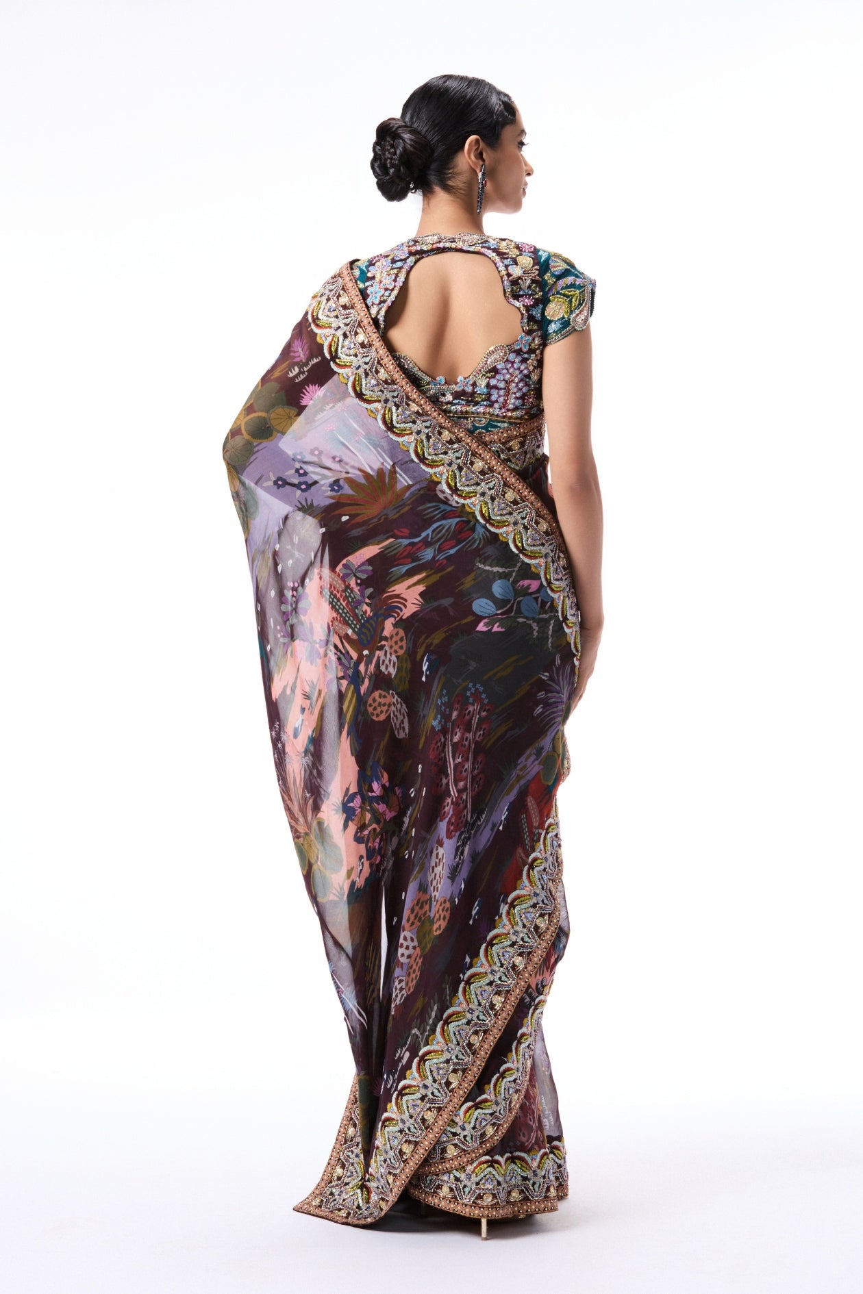 Back profile of the teakberry printed viscose organza saree paired with a raw silk blouse.