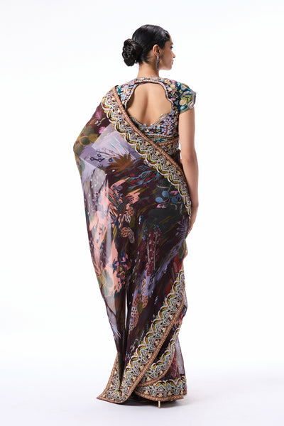 Back profile of the teakberry printed viscose organza saree paired with a raw silk blouse.
