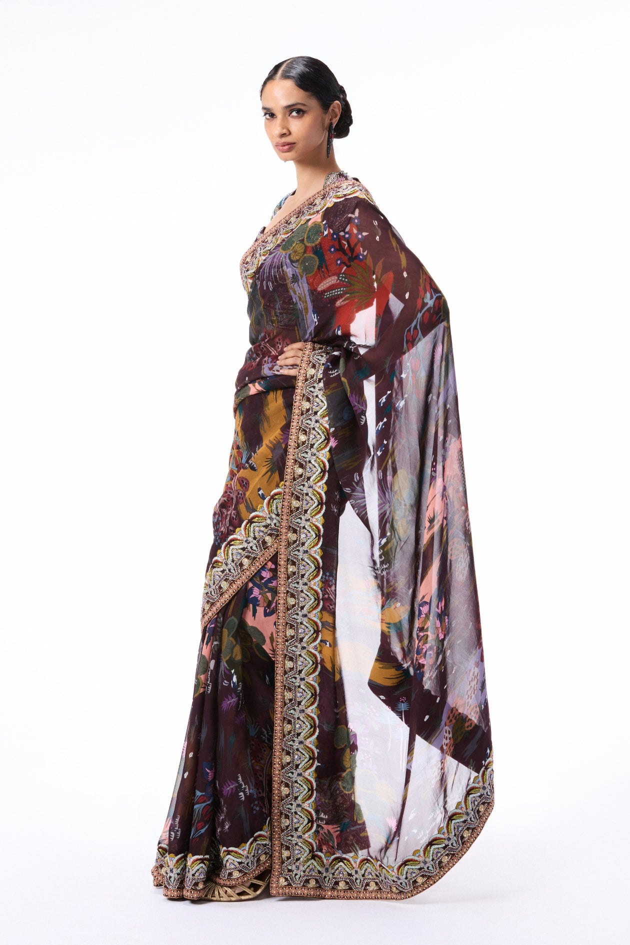 Side angle shot of the raw silk blouse styled with the teakberry printed organza saree.
