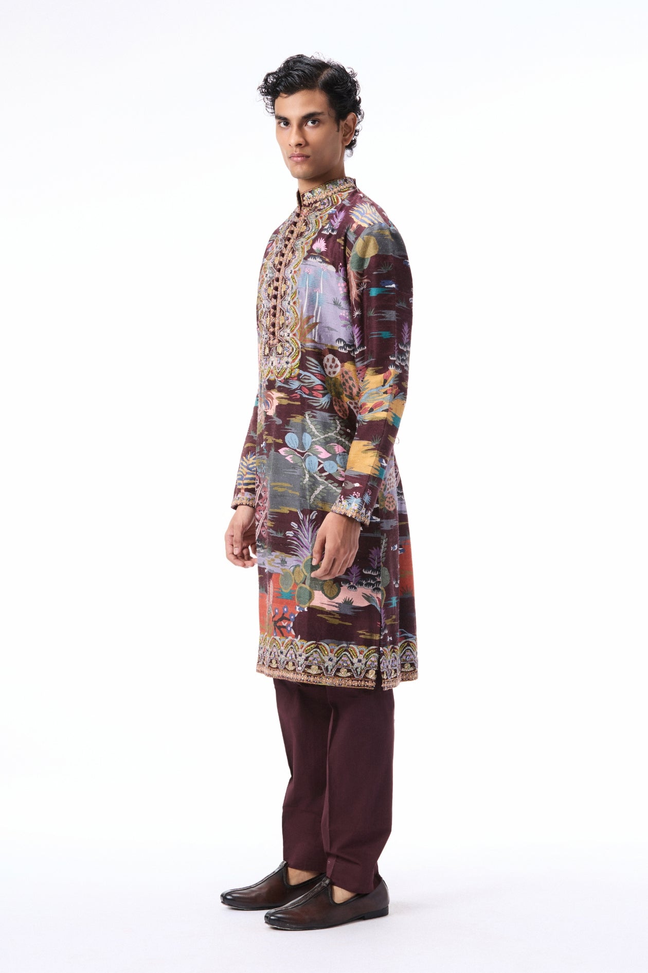 Side angle view of the teakberry printed raw silk kurta highlighting applique embellishment.