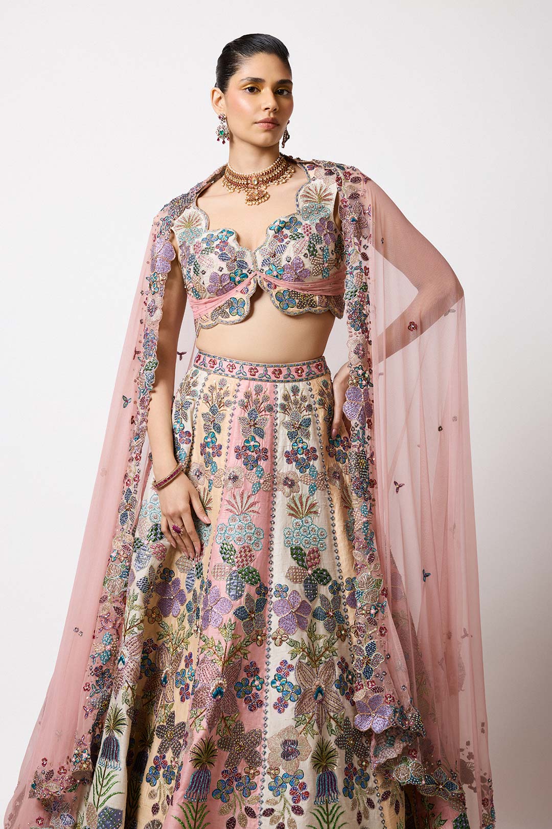 Woman in tricolour applique lehenga side profile look