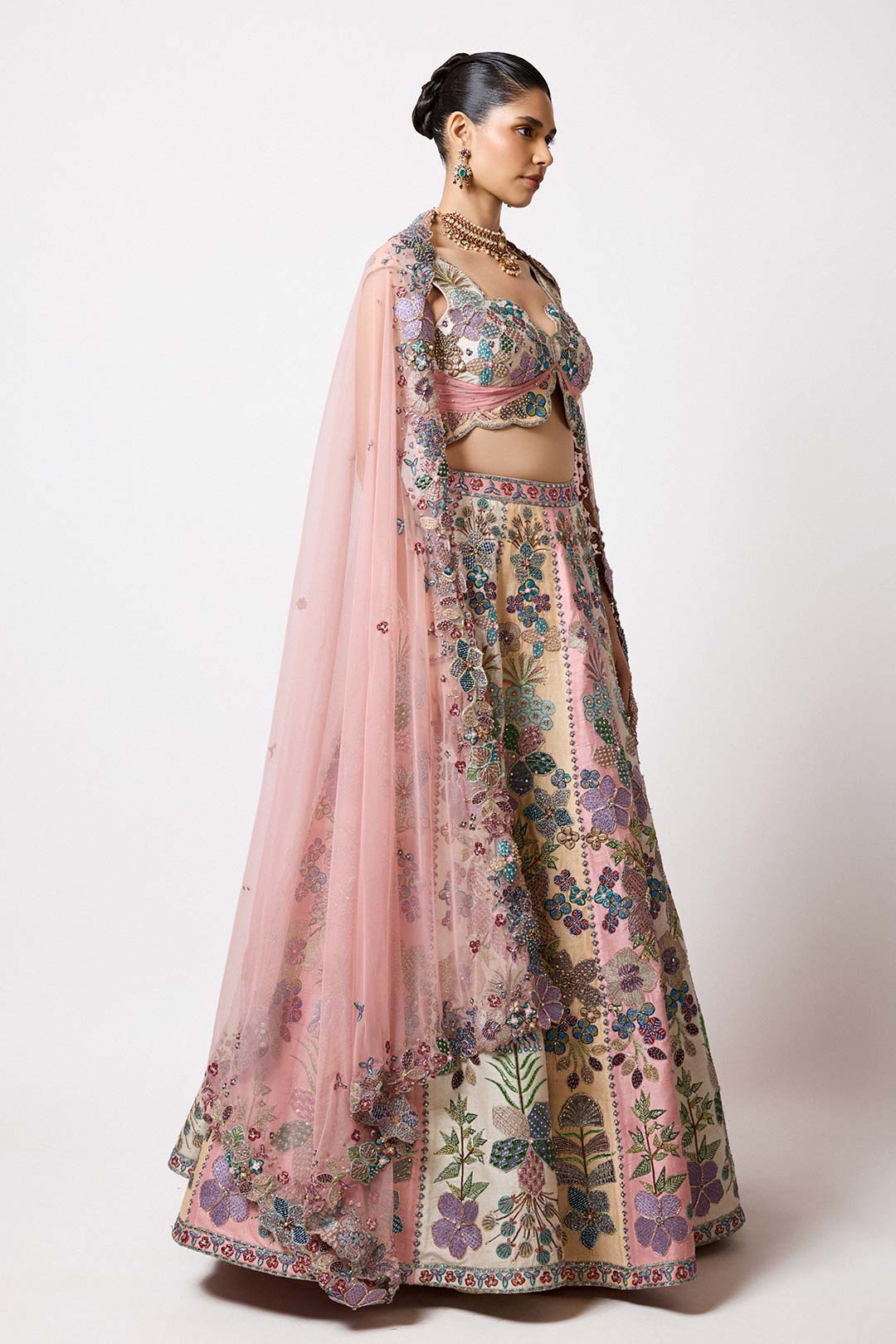 Woman in tricolour HK lehenga with applique right profile