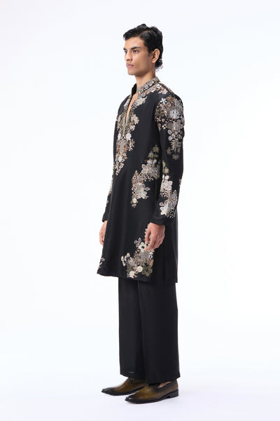 Man wearing a black floral embroidered sherwani 