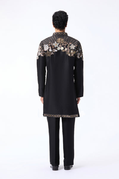 Black kurta with floral embroidery on a white background