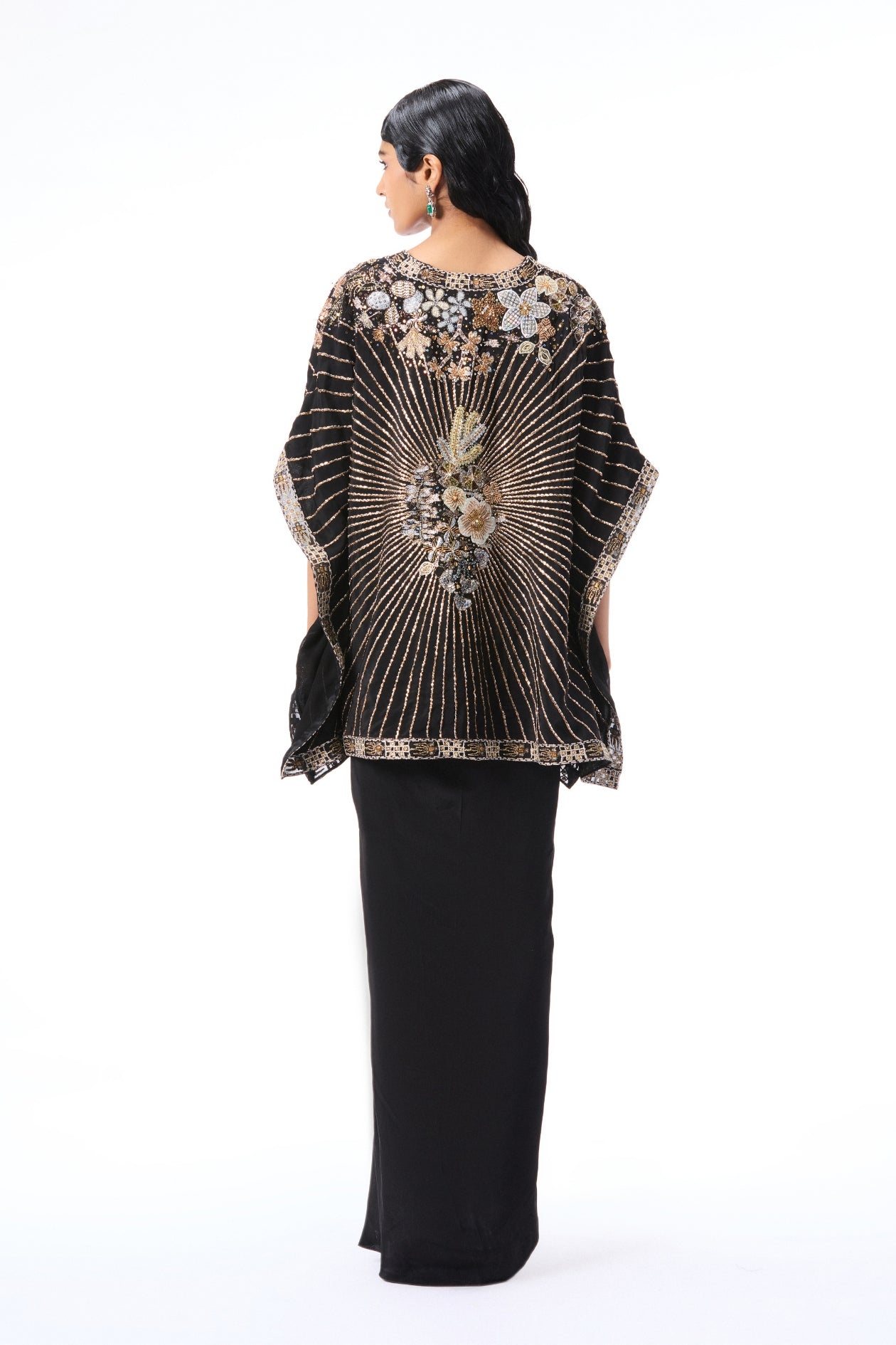 Back view of black applique embellished mulberry crepe tunic with pleated draped skirt