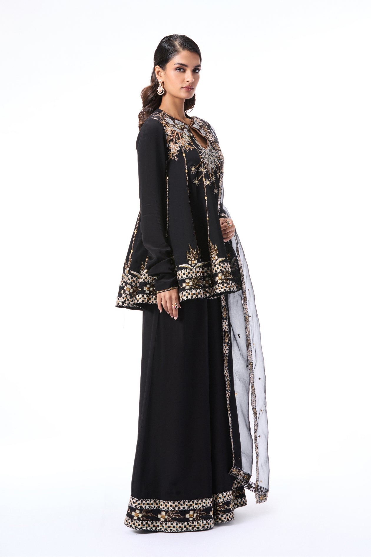 Left side view of black embellished kurta with sharara and dupatta
