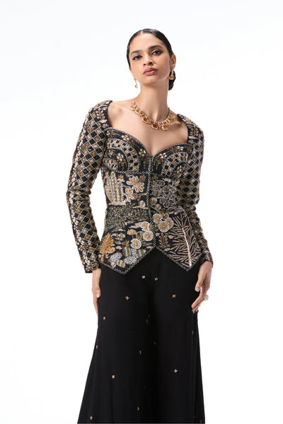 Close-up of applique detailing on black raw silk top from Aisha Rao