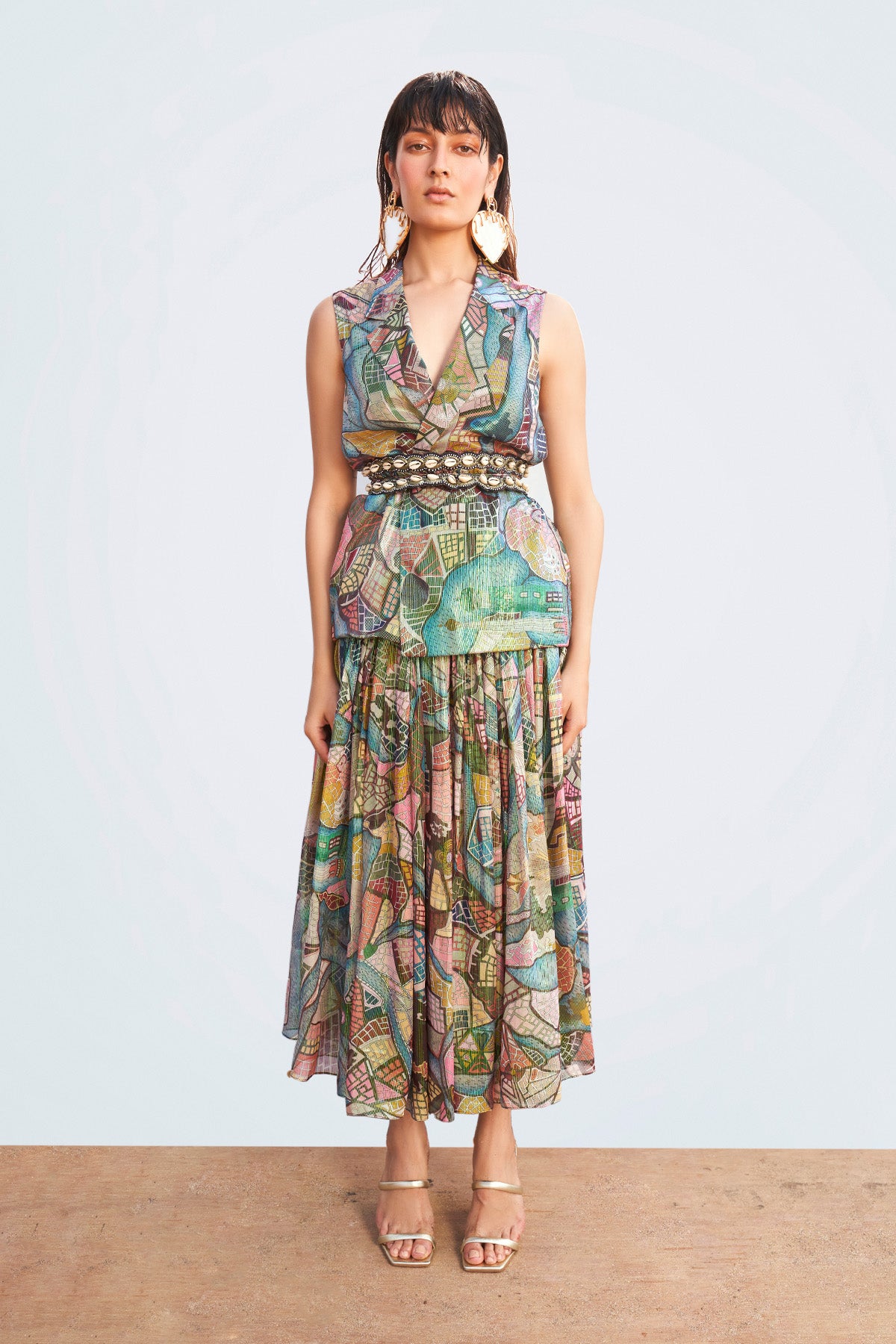 Close-up of fabric pattern and stitching on waistcoat and skirt front.