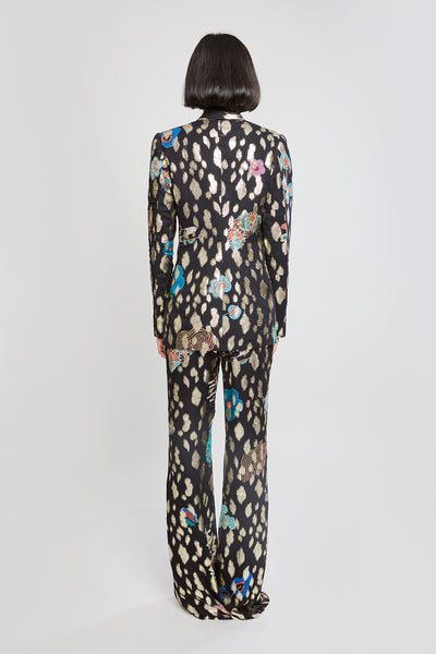 Rear silhouette of black pantsuit ensemble