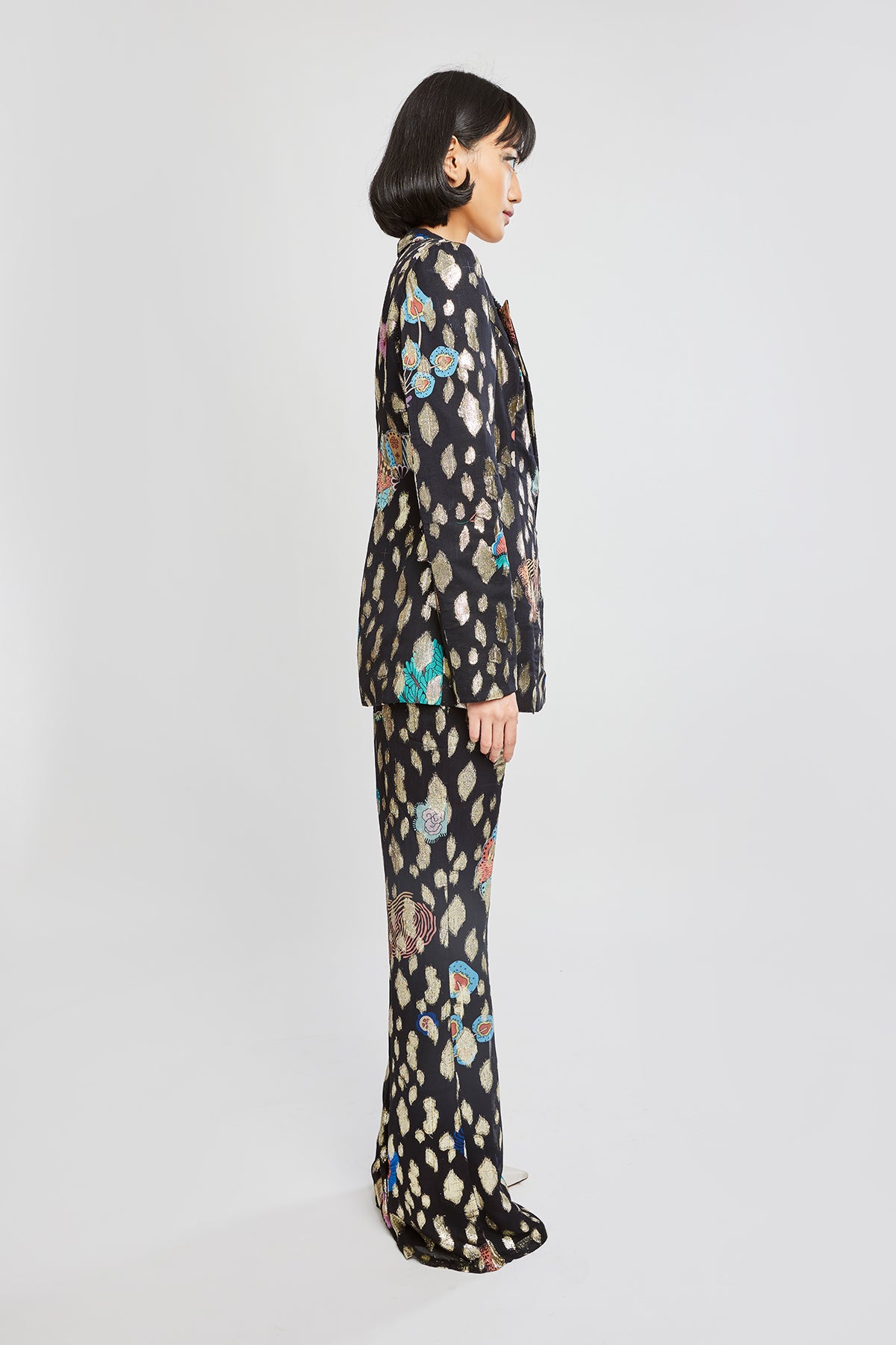 Wide-leg pant drape on right side of blazer set