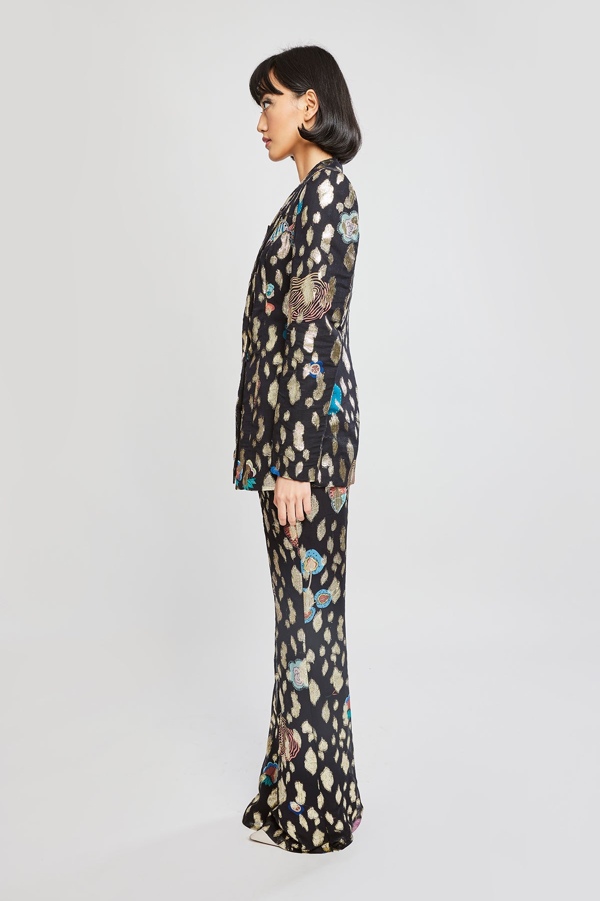 Neha Dhupia in wide-leg pants and black blazer – left view