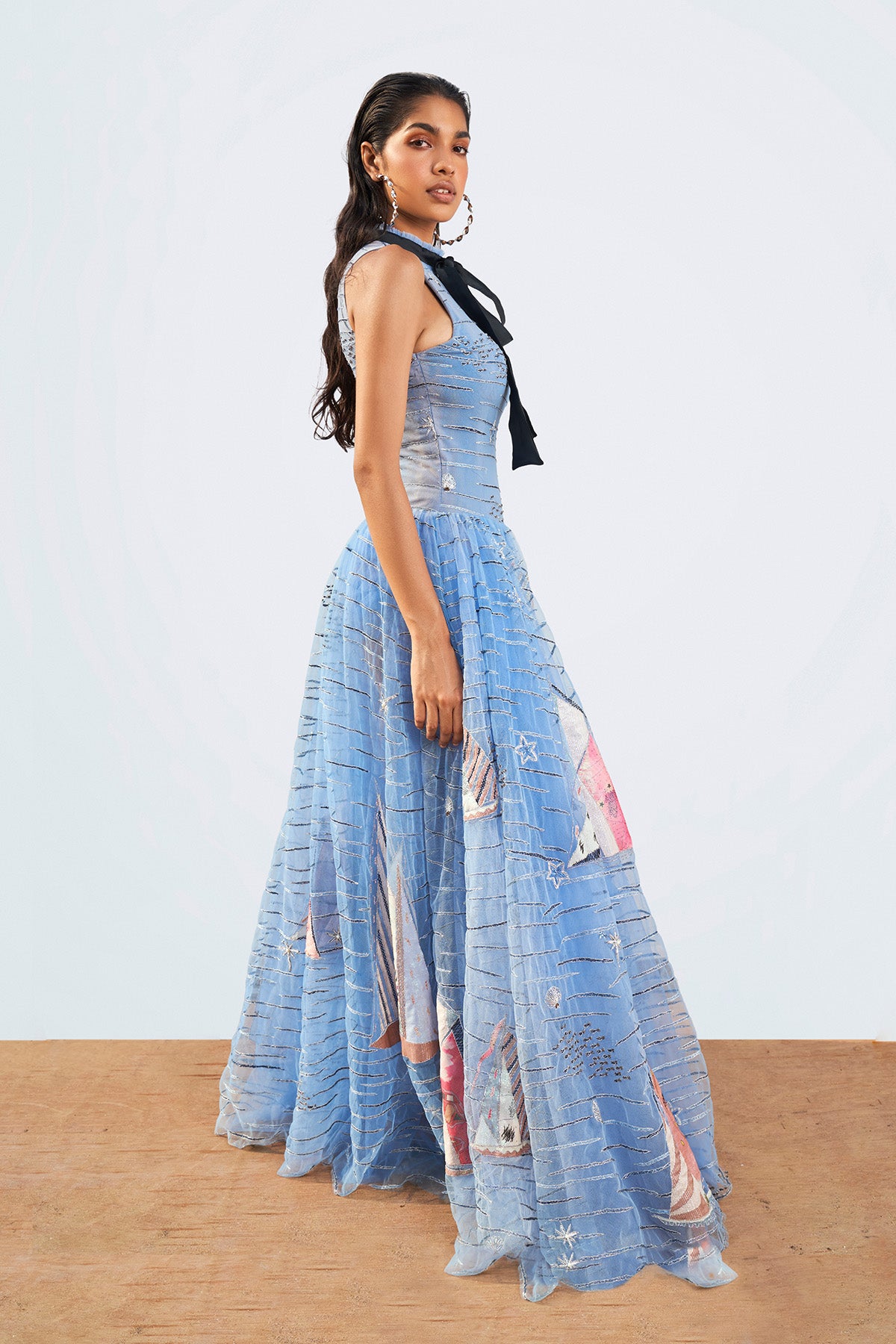 Left profile of Light Dodger Blue Couture gown.

