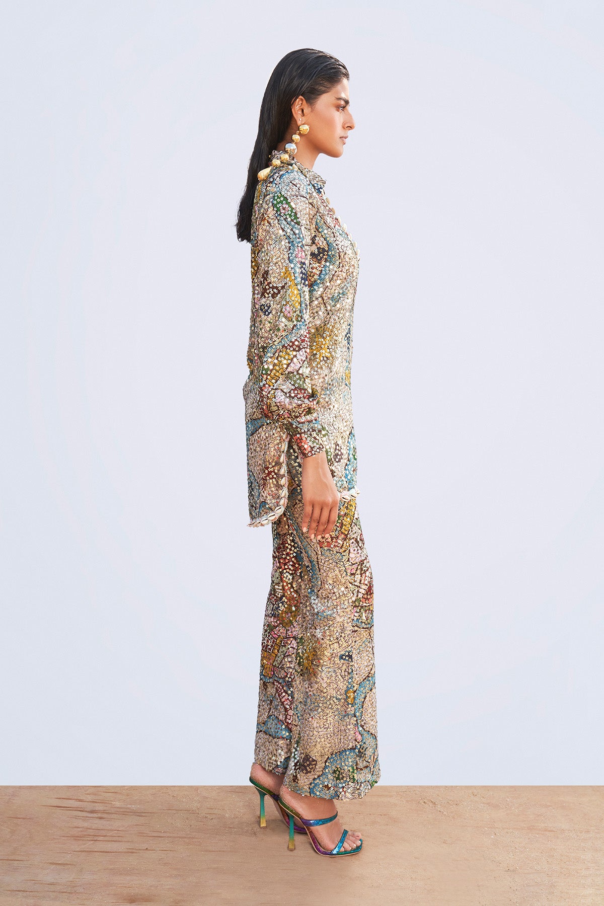 Side angle presenting the Starboard & Port ivory sequin appliqué tunic with high waist trouser styling