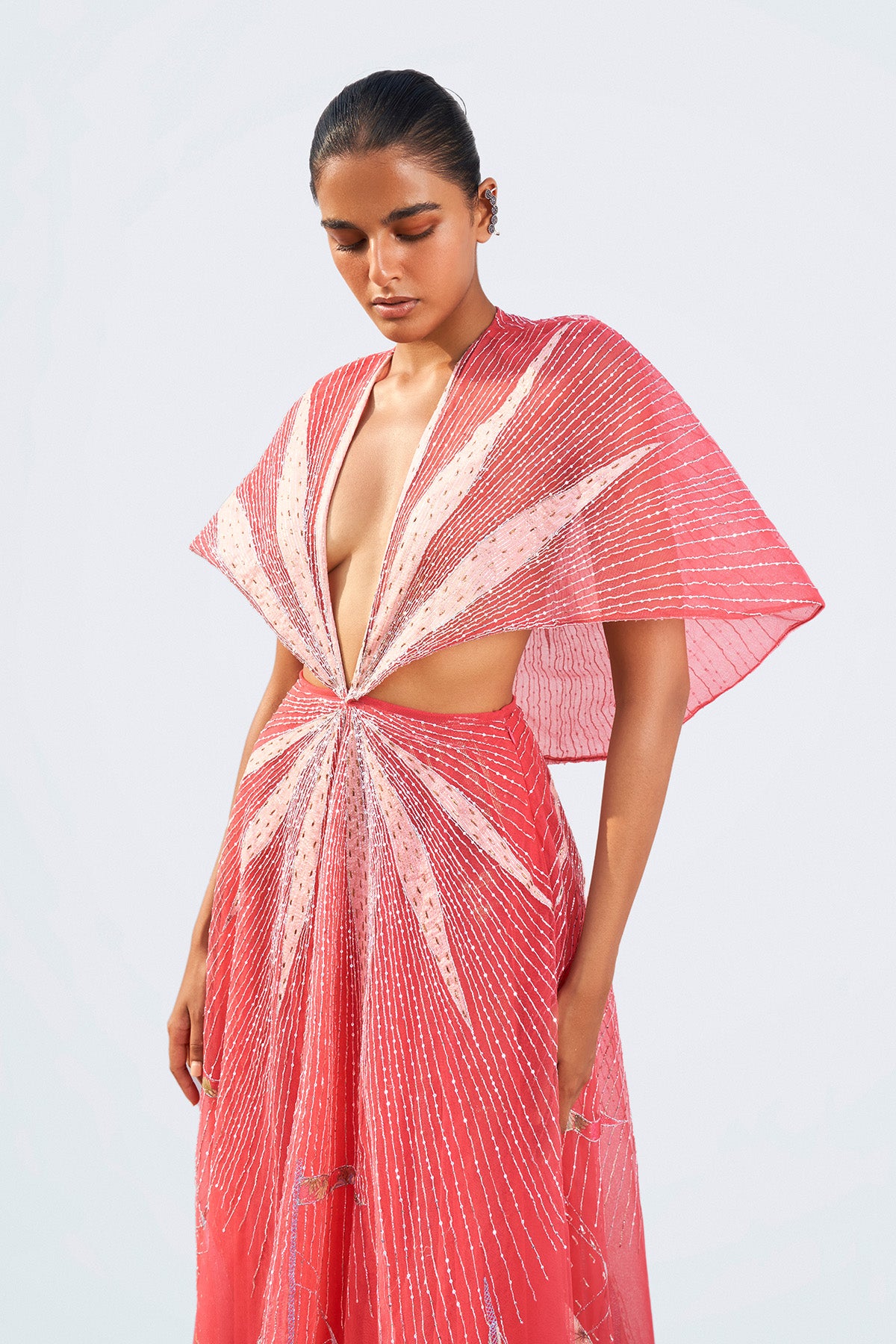 Left profile of magenta printed sleeveless gown.