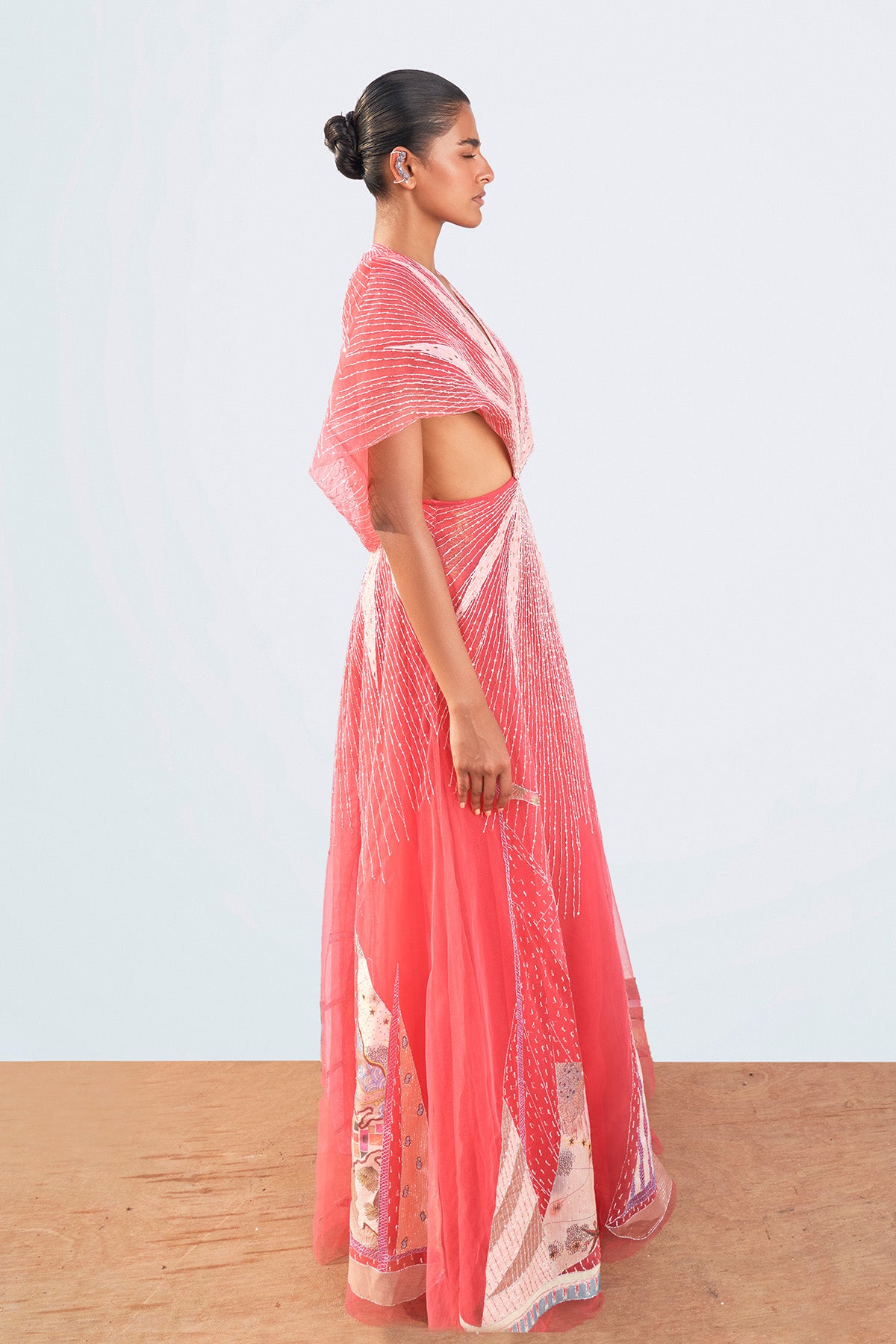 Right side view of printed sleeveless gown.