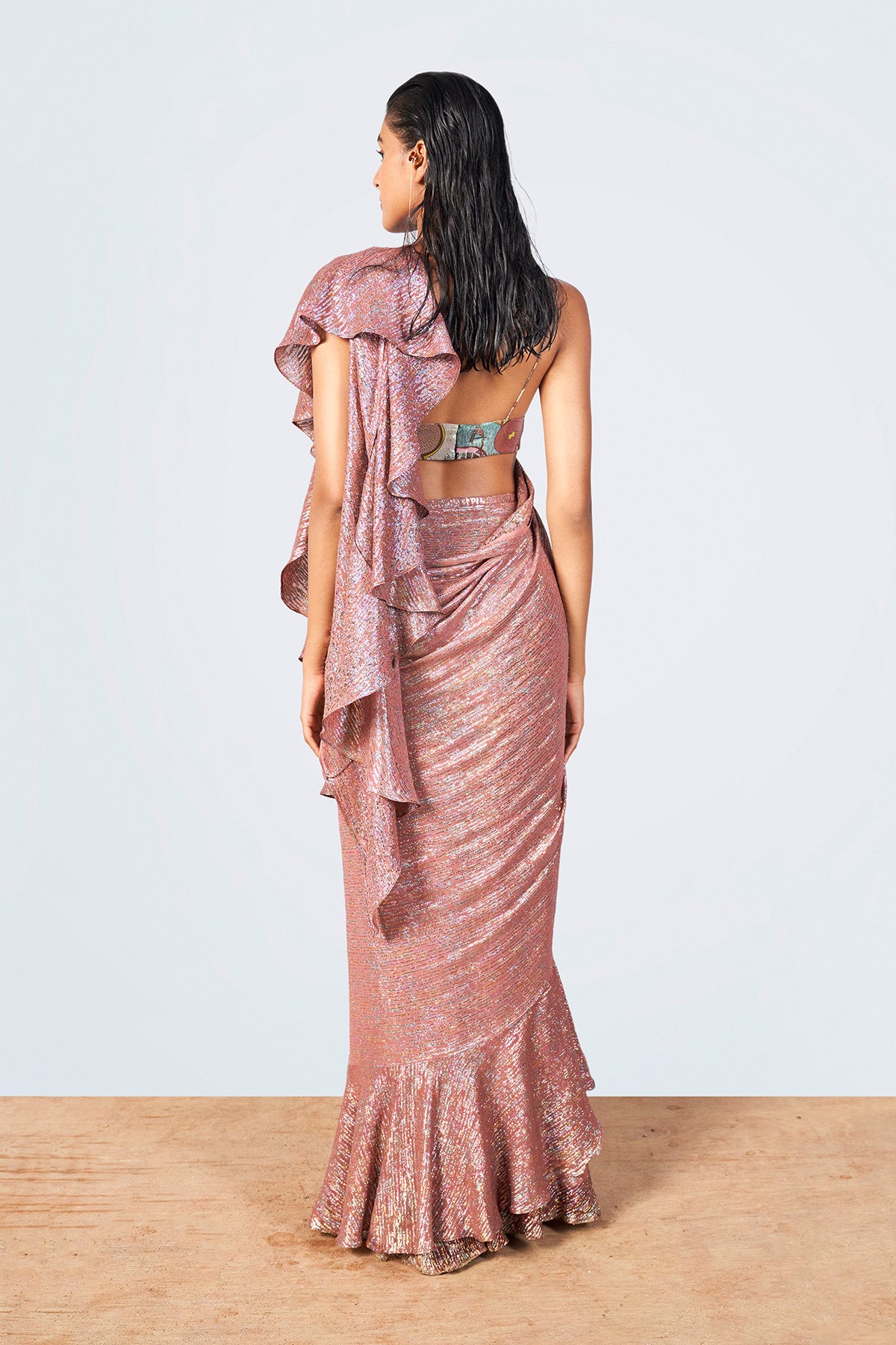 Close-up of lurex fabric and blouse print on left side.